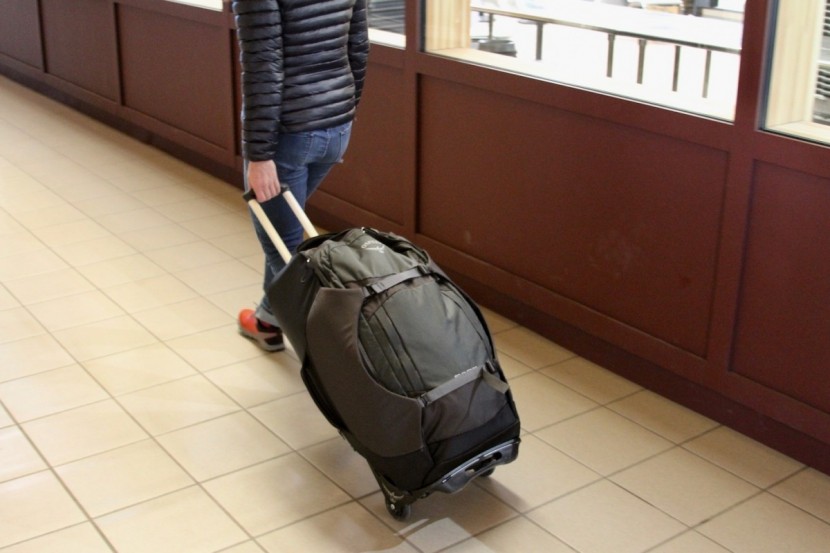 osprey sojourn 80l - put it into roller mode for all smooth surfaces that you encounter.