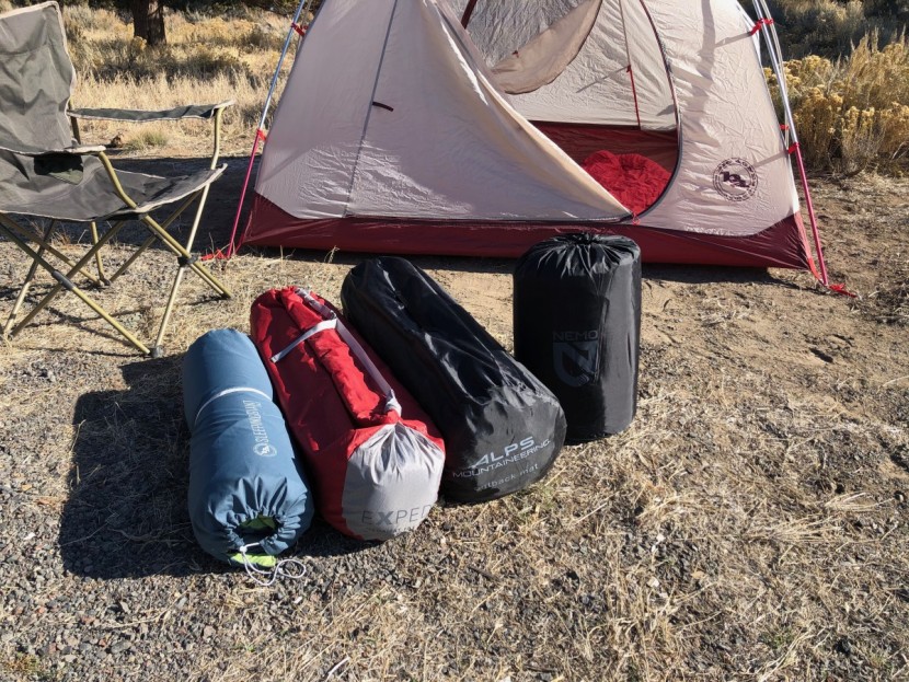 alps mountaineering outback - packed size of four models of camping mattresses.