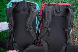 Compare the S-curve shoulder strap (left) to the J-curve (right).