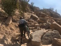 Hiking up the infamous Horsethief Bench in Fruita, Colorado. The...
