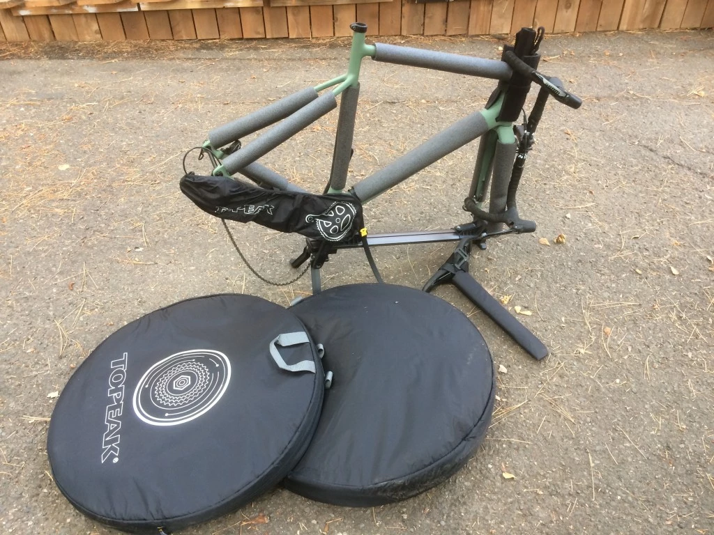 bike travel case - the mounting stand, wheel bags, and frame protection. even inside...