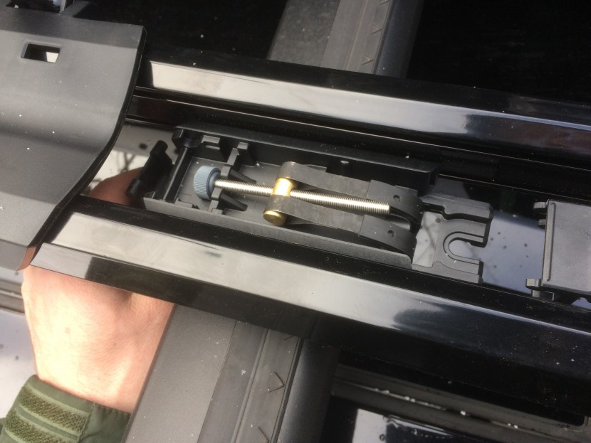 yakima highroad - loosening the bolt with the silver knob on the left de-tensions the...