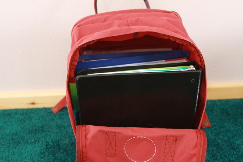 fjallraven kanken 15&quot; - here we fit two binders and textbooks inside the boxy design. it can...