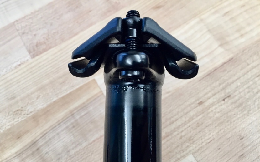 oneup components v2 - the saddle clamp has a slotted upper half for easier removal and a...
