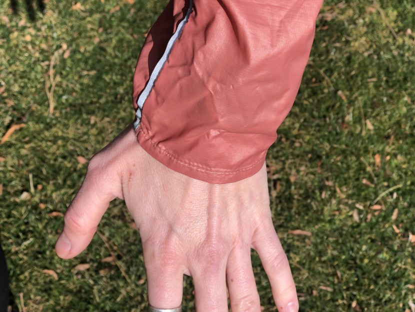 smartwool merino sport ultra light hoodie for women - half elastic cuffs and a strip of reflective material on each...