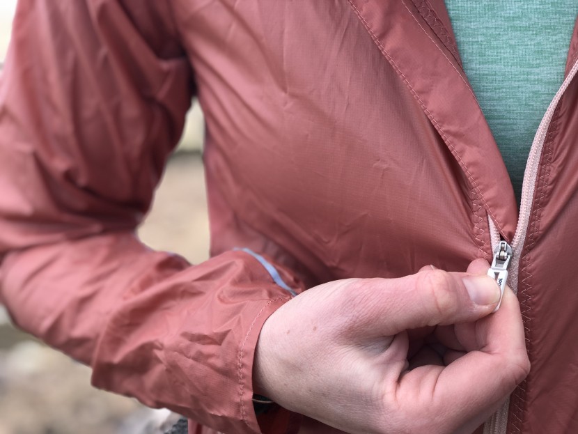 smartwool merino sport ultra light hoodie for women - with how annoying this storm flap is (it gets in the way repeatedly...