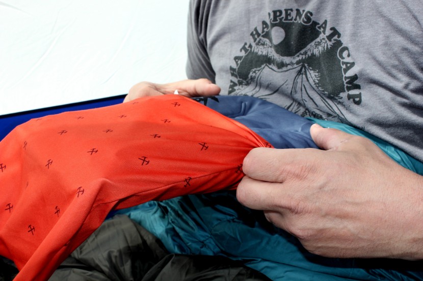 sliding the pillowcase over the camp dreamer.