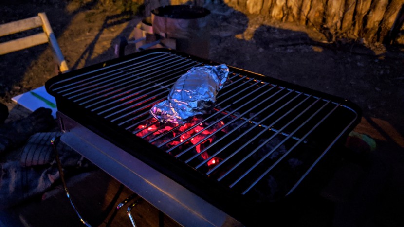 portable grill - piling coals directs heat to where you need it, which is...