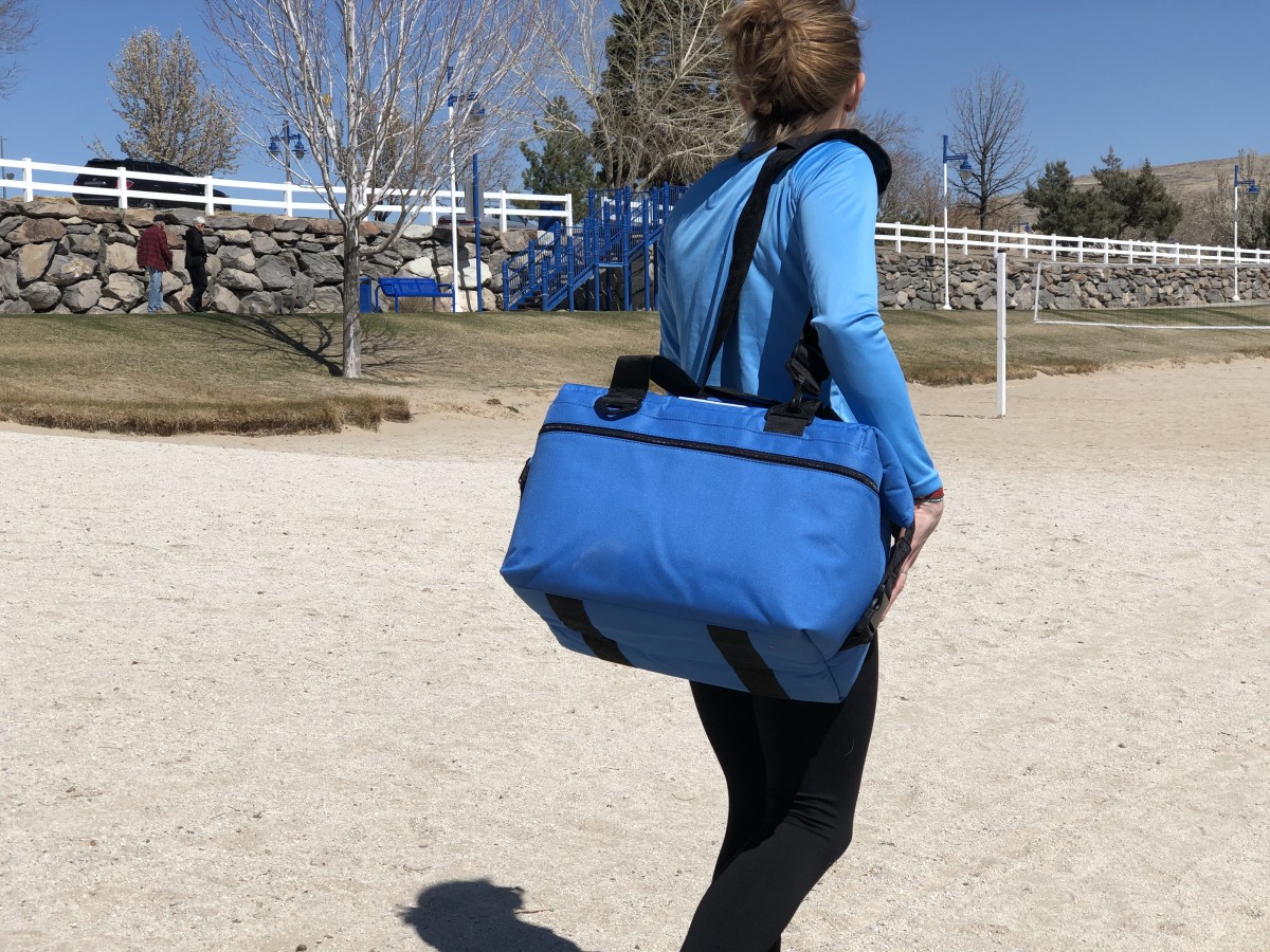 AO Coolers 24 Pack Canvas Cooler Review (This duffel style cooler is uncomplicated to carry with comfortable, asymmetrical strap attachment points.)