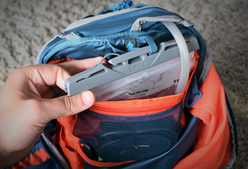 thule vital 6l - it can be a pretty awkward process to maneuver the t-shaped hanging...