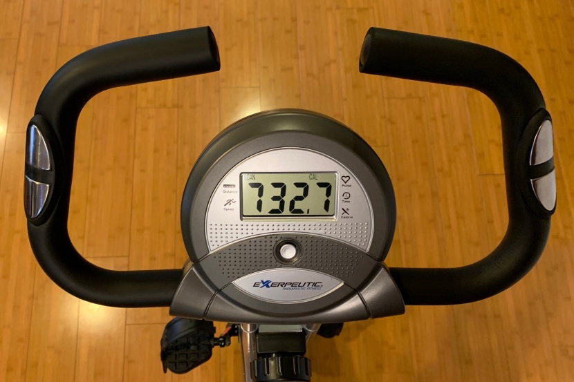 exerpeutic folding magnetic upright bike with pulse - the battery-powered console has an lcd screen and a single button to...
