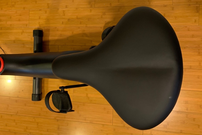 schwinn 130 upright bike - the padded seat is a lot like a traditional bike seat that you might...