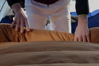 Rolling up the Deer Hunter after another night under the stars.