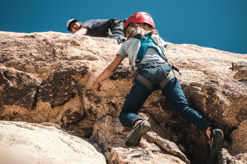 black diamond momentum full-body - dad belays from the top as the kid crusher pulls over the bulge.