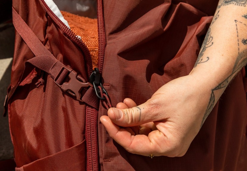 rei co-op ruckpack 40 - when fastened, the compression straps block the zippers from fully...