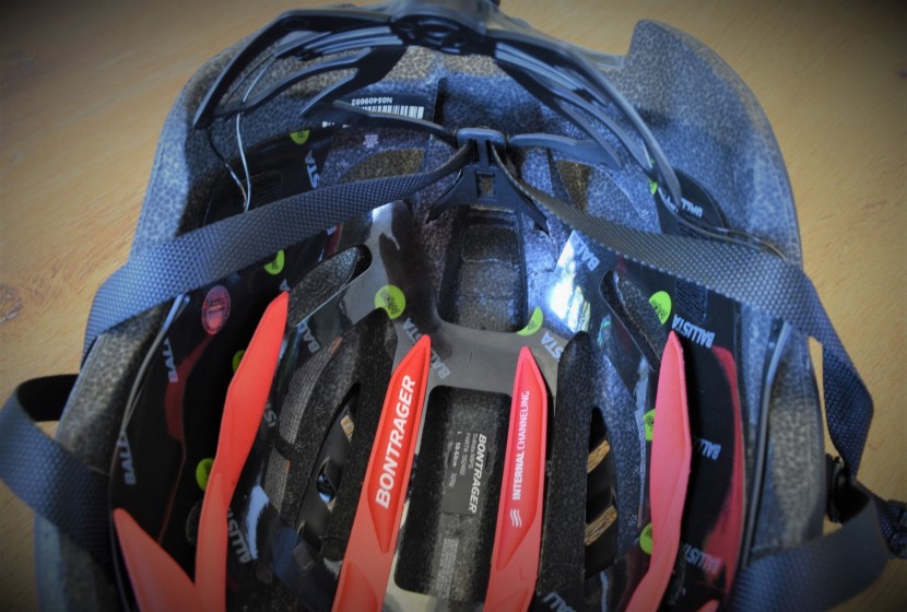 bontrager ballista - the rear strap system is not routed around the outside perimeter of...