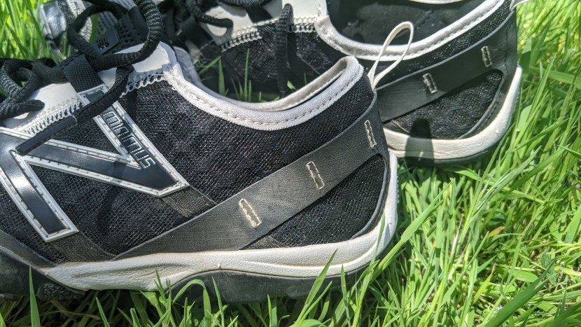 new balance minimus trail 10v1 - the abrasion-resistant double-diamond mesh is backed up with a strip...