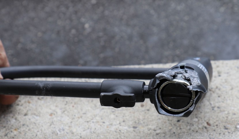 via velo u lock with cable - after taking a beating from a hammer, this lock didn't look so hot...