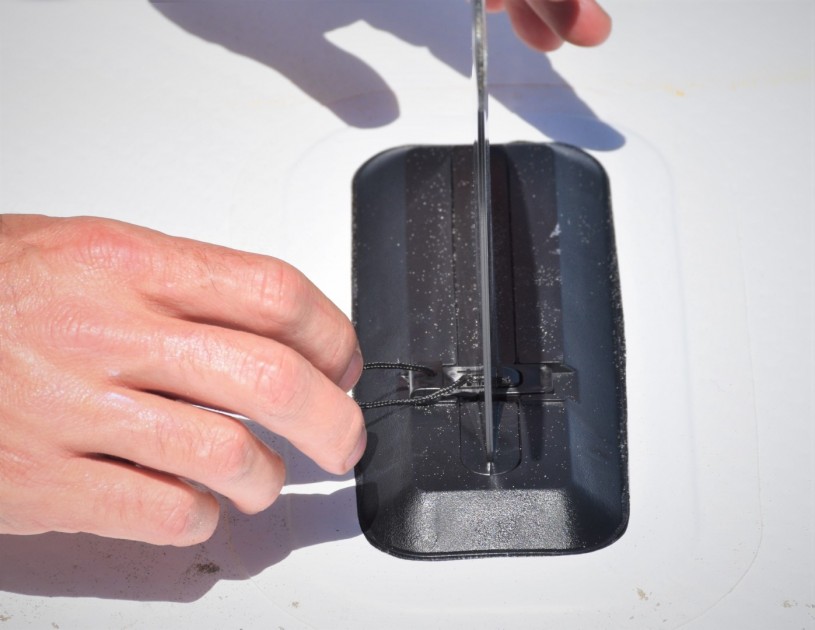 roc 10&#039; explorer - the sliding tab that clicks into place on the removable center fin...