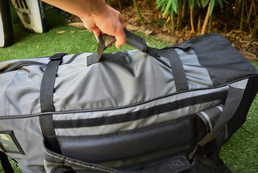 the comfortable carry bag has backpack straps, grab handles, and...
