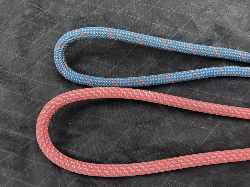 these two bights of rope are laying naturally on the ground. it is...