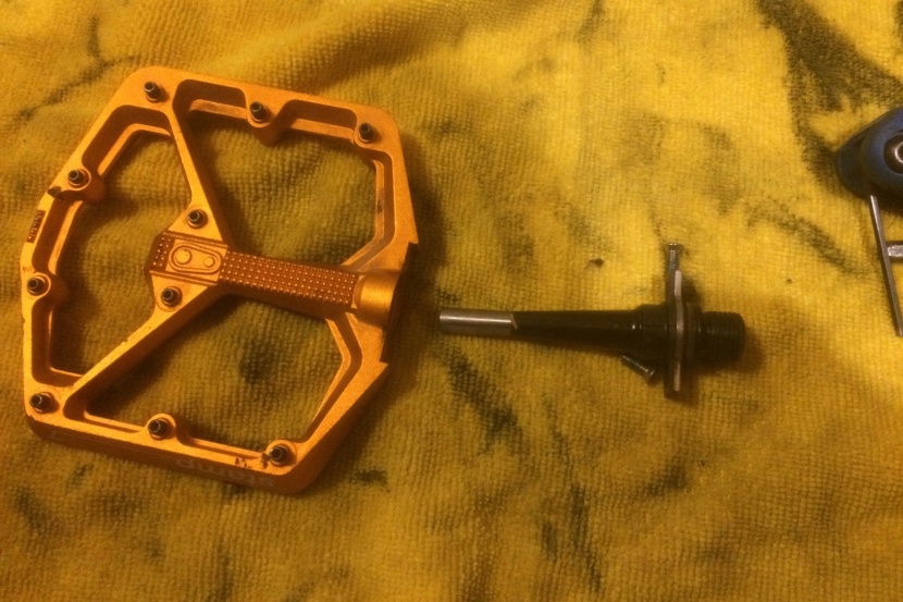 once the screws are removed you can pull the axle out of the pedal...