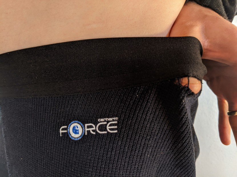 carhartt base force lightweight bottoms - more likely a flaw in design than a lack of overall durability...