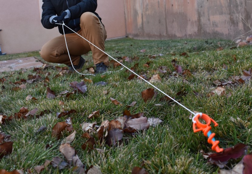 tent stakes - the orange screw withstanding a mighty pull in relatively soft soil.