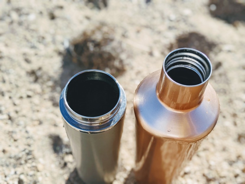 water bottle - a wide mouth on the left and a narrow mouth on the right.