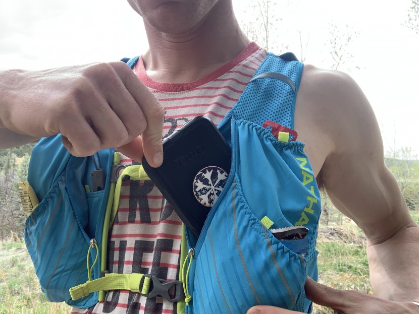 nathan pinnacle 12l - two waterproof pockets behind the front pouch pockets keep important...