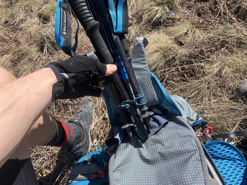 a helmet harness includes an integrated pole carry system.