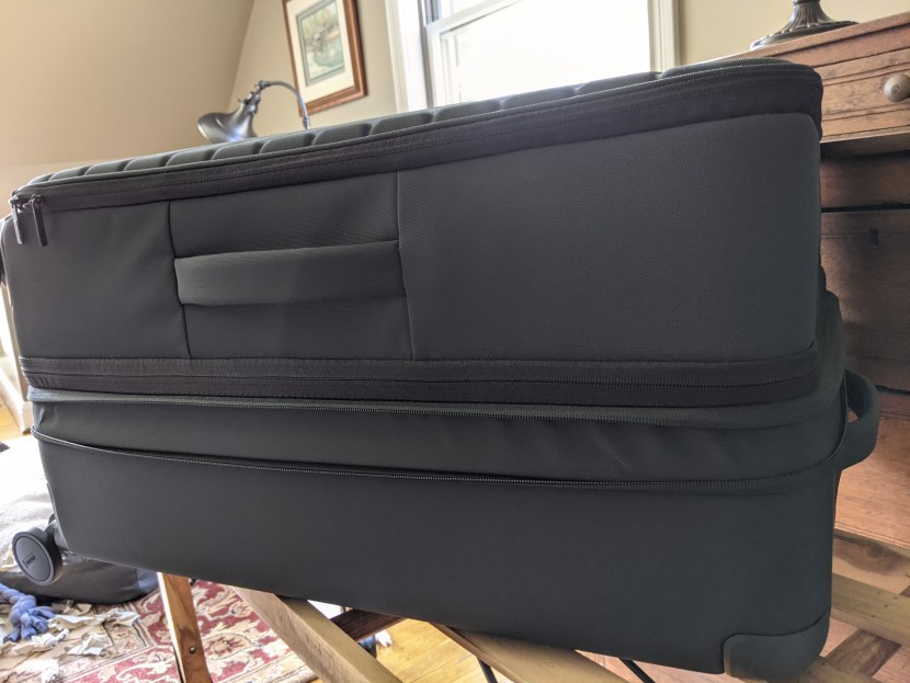 away expandable large - that strip of fabric below the middle zipper is the expandable...