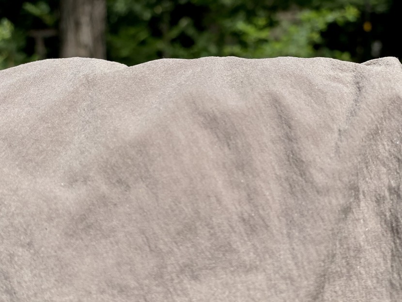 houdini wadi short for women - a close-up after spraying water reveals no water resistance from the...