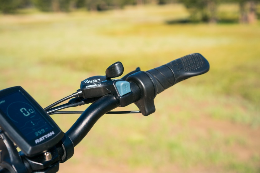 rattan folding electric bike - the twist throttle is integrated into the right grip, and it has a...