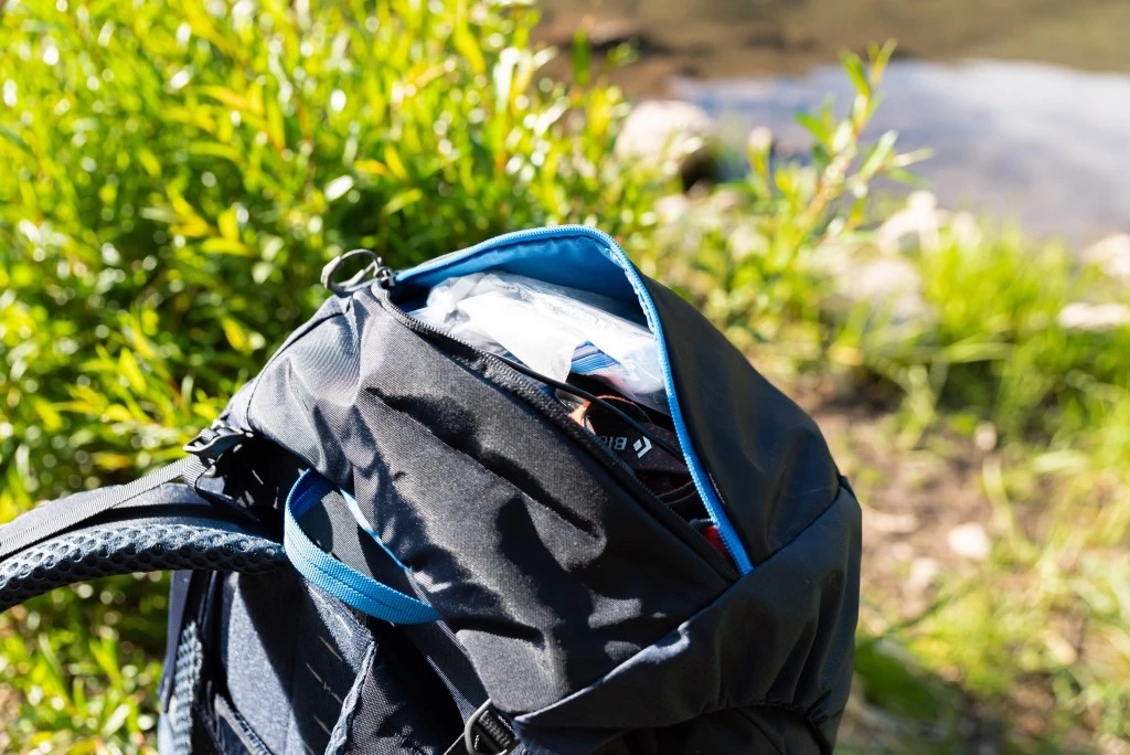 budget backpacking pack - the lid on the stout 60 is roomy; good for first aid, toiletries...