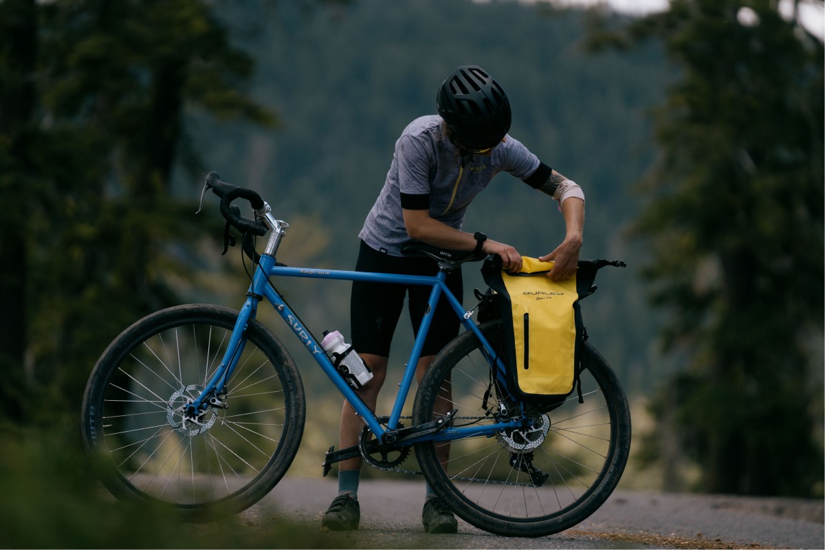 Burley Pannier Set Review (Our tester puts away a layer and packs up the Burley set on a gravel ride in North Lake Tahoe.)