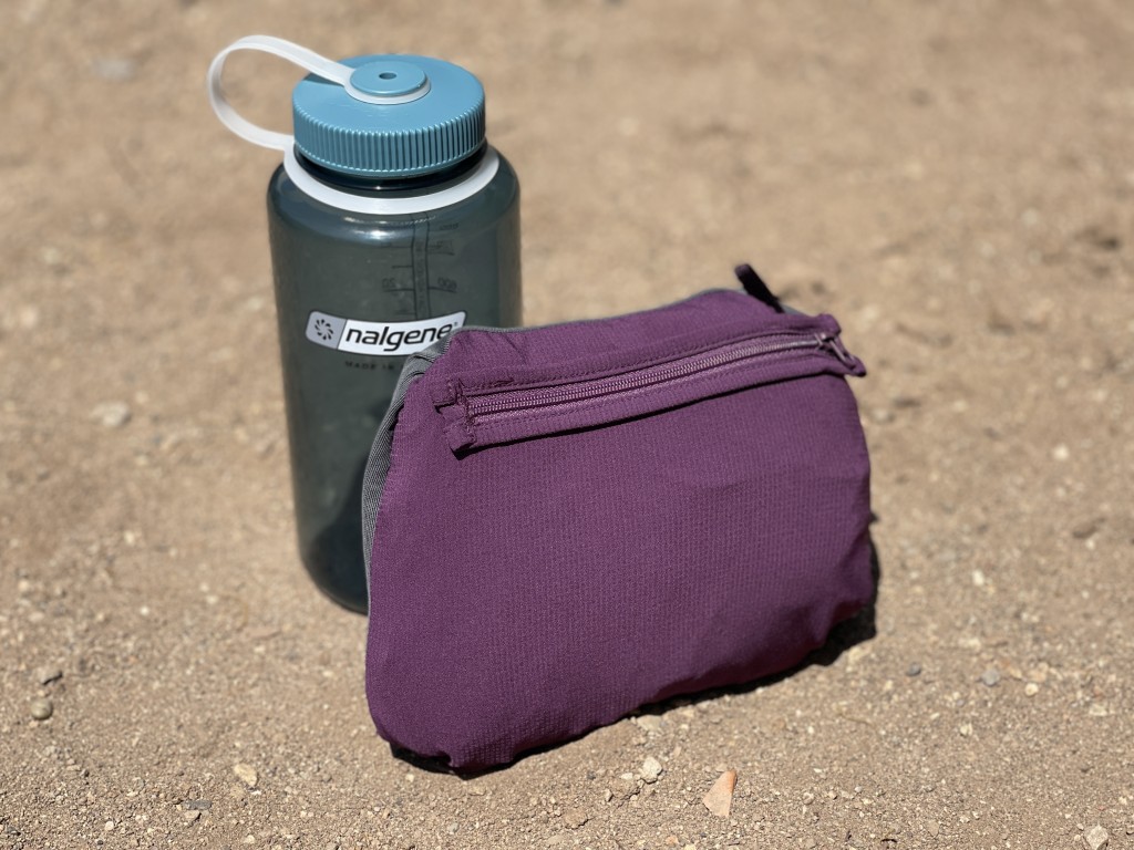 outdoor research helium wind hoody for women - packed up into its single zippered pocket.