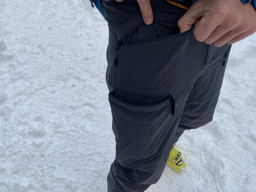 the right side has a waist pocket, and the thigh pockets on both...