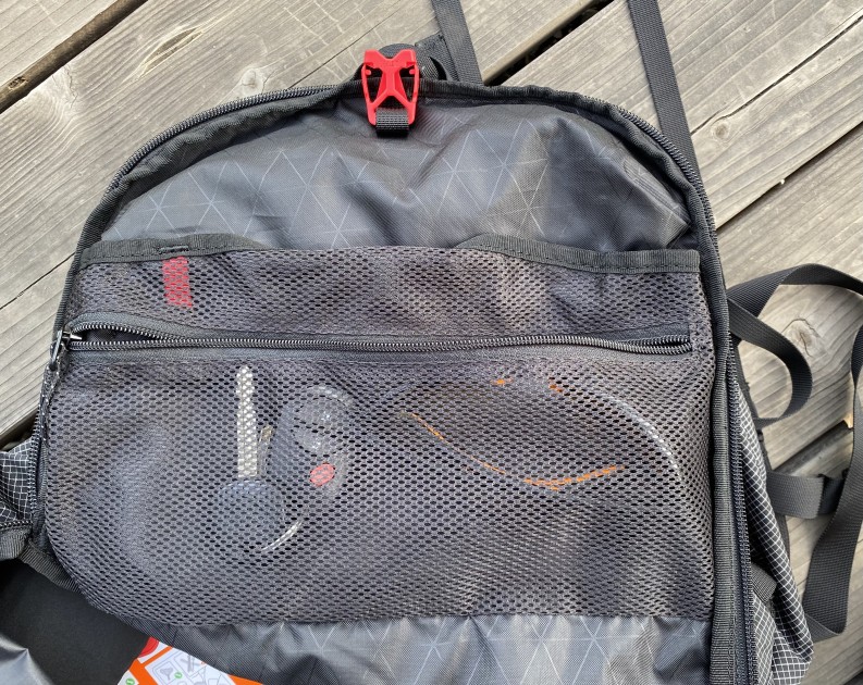 this photo shows the small, mesh zippered pocket in the main...