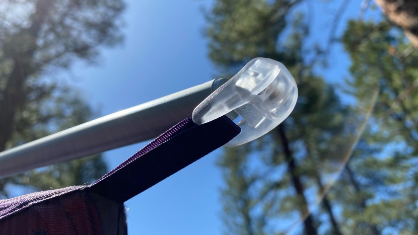 a plastic snap pulls the front and back door taught.