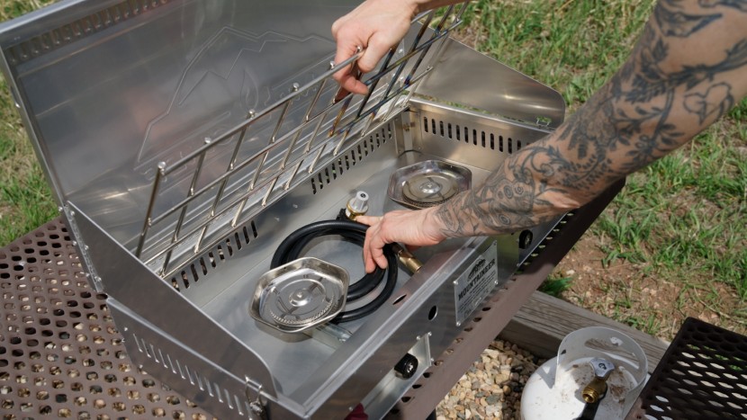 camp chef mountaineer 2x - to pack up the stove, the regulator hose fits conveniently under the...