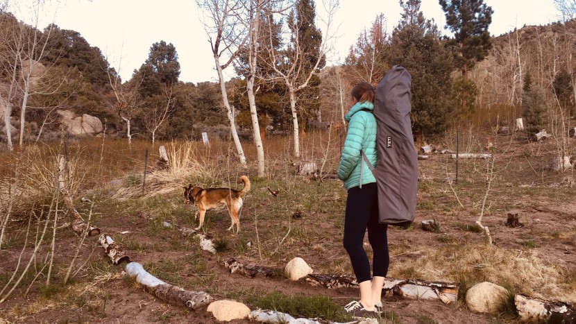 amanda and nunatak greenberg demonstrate the back-pack style carry...