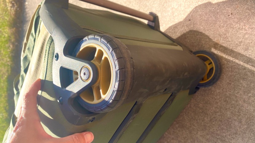 rei co-op big haul recycled rolling duffel 34&quot; - the rugged wheel housing and bottom chassis of rei&#039;s big haul...