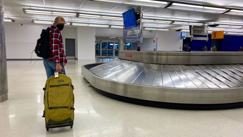 rei co-op big haul rolling duffel coming off the luggage carousel at...