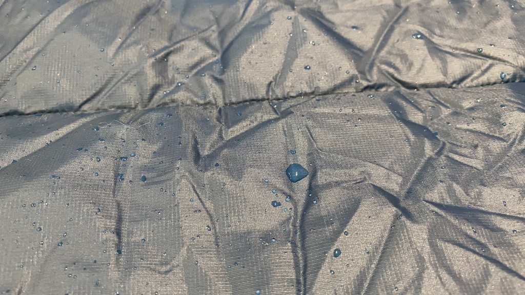 rei co-op camp wrap - it's certainly not impermeable but the material is water-resistant...