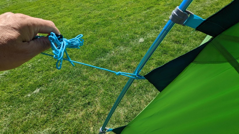 the built-in guy-lines roll up and store neatly in the triangular...