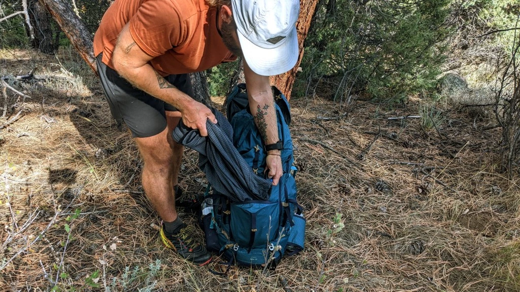 decathlon forclaz mt500 air 50+10 budget backpacking pack review - the front pocket is great for stashing a coat to grab quickly later.