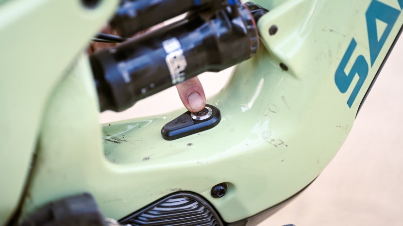 the power button sits below the rear shock, right above the motor...