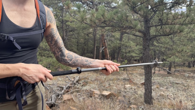 to "fold" the poles, press the aluminum button, and then slide the...