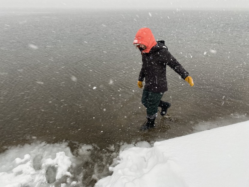 winter boots womens - wading through cold lake waters to test our boot&#039;s waterproofness.